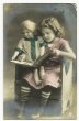 画像1: お人形さんと絵本を読む女の子 (1)