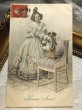画像1: Postcard　花束を持つ犬と女の子　H.Shubert　M.M.VIENNE (1)