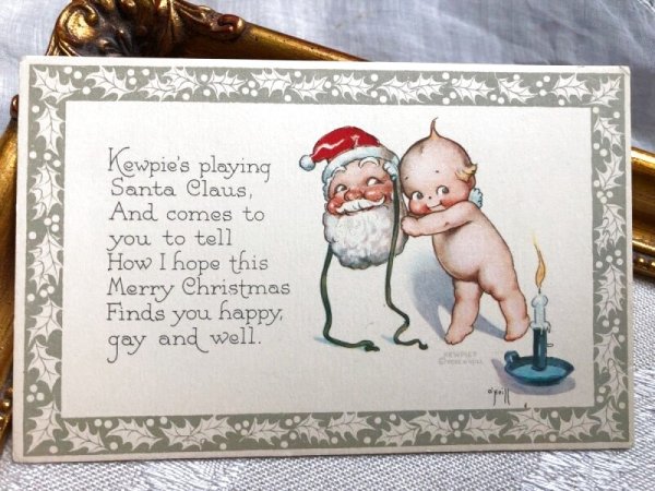 画像1: Postcard  クリスマス　サンタクロースのお面とキューピーちゃん　天使　Rose O'Neil　（未使用） (1)
