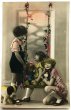 画像1: Postcard　アンティークポストカード　ブランコに乗る女の子　お人形　ぬいぐるみ　ブリンキー　犬　猫 (1)