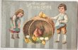 画像1: Postcard  アンティークポストカード　イースター　子どもたちと大きなバスケットの中のヒヨコとニワトリ　 (1)