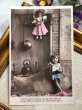 画像2: Postcard　アンティークポストカード　大きな木靴に座る女の子とお人形 　フランス (2)