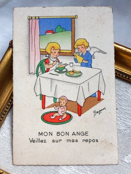 画像2: Postcard  アンティークポストカード クリスマス 朝食を食べる女の子と天使 お人形 Benjamin  (未使用) (2)