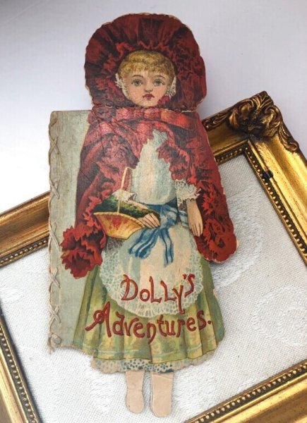 画像1: Vintage Book  アンティーク洋書　絵本　Dolly's Adventures. お人形さんの冒険　赤ずきんちゃん風のお人形　ダイカット絵本　1898年 (1)