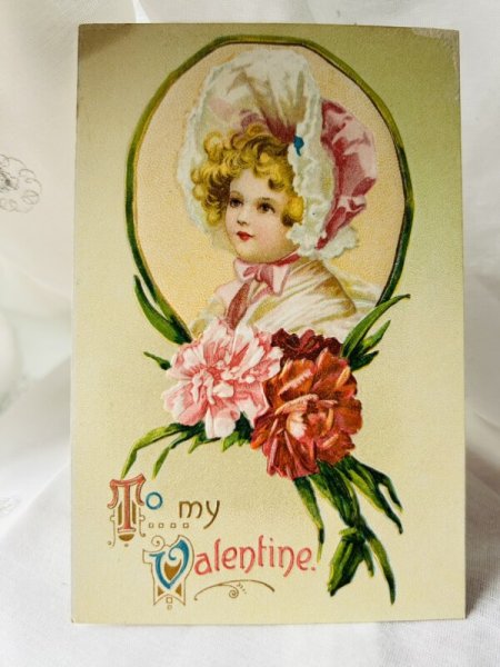 画像1: Postcard  アンティークポストカード　バレンタイン　ボンネット帽子の女の子　カーネーション　Ellen Clapsaddle　（未使用） (1)