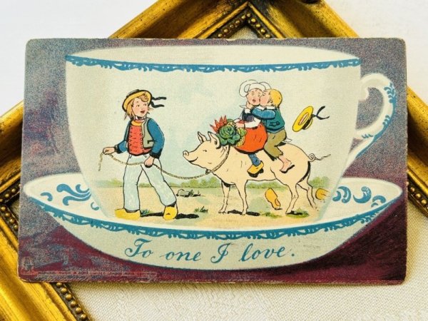 画像2: Postcard  アンティークポストカード　バレンタイン　豚に乗ってキスをするオランダの子ども　ティーカップ (2)