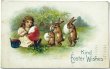 画像1: Postcard　アンティークポストカード　イースター 　卵に色を塗る女の子と並ぶウサギさん　アメリカ1909年 (1)